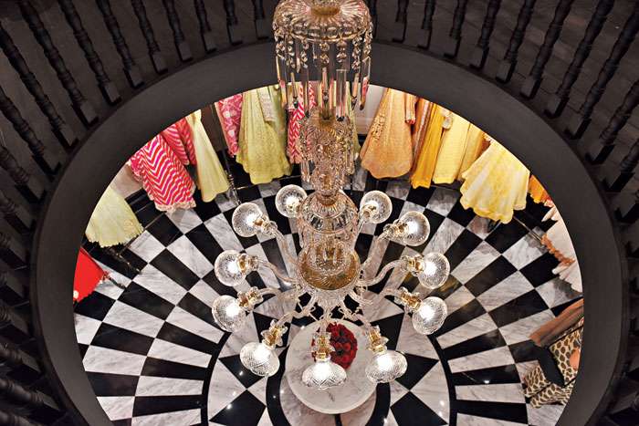 The first floor mostly features blacks, blues and ivories for evening wear. There are a lot of handloom Benarasis and velvets in this section besides chikan and bandhnis. This part of the store also has the Raas Garba bandhni from Kutch on display. “The Raas Garba bandhni is considered auspicious for weddings and has the wedding theme designed on it along with Rajasthani gota patti work. The pret line features a lot of organza and linen. This section of the store also has a few cotton outfits,” said Karishma.