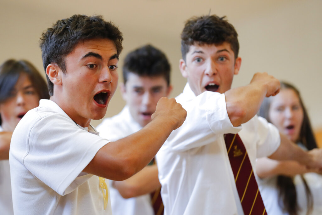 Students perform the Haka during the New Zealand Prime Minister Jacinda Ardern's visit to a high school in Christchurch.