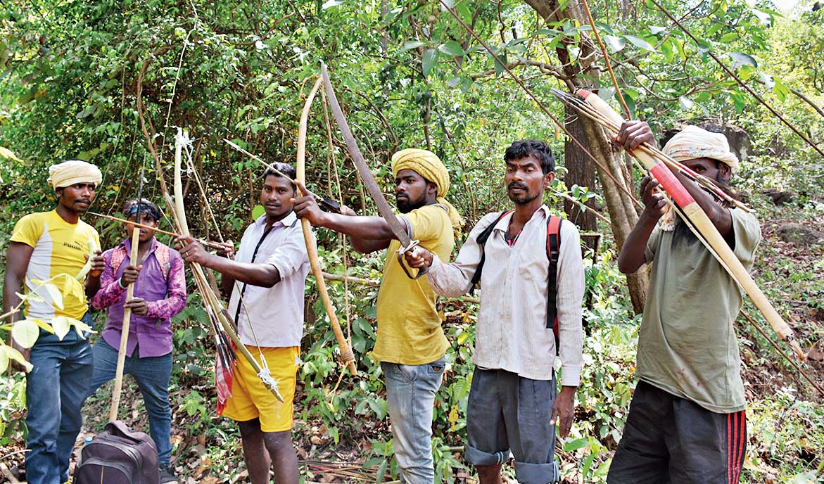 Tribals with traditional weapons head for Sendra at Dalma hills
