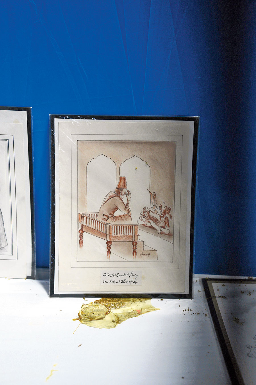 One of the pictures on display at the exhibition shows Ghalib seated in front of an audience, delivering what seems to be a sermon, a bottle peeping out of his pocket