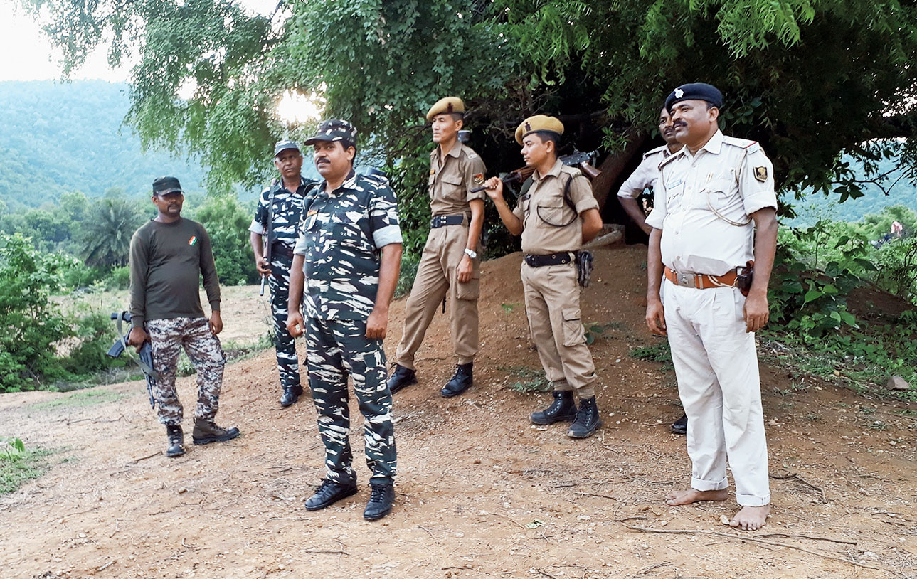 CRPF jawans and policemen at the encounter site. 