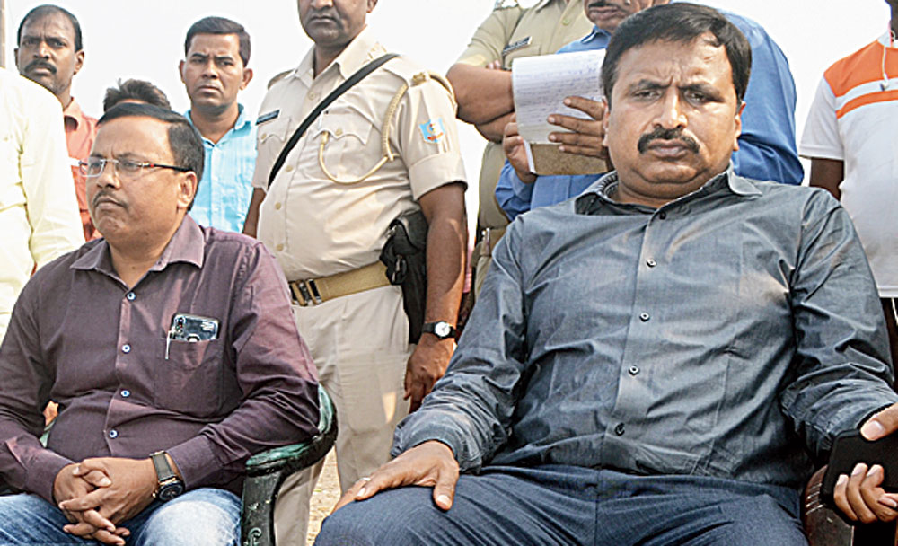 Dhanbad SDO Raj Maheshwaram (right) at Liloripathra in Jharia, Dhanbad, on Monday.  

