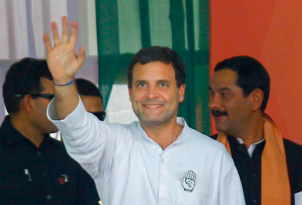 Congress Party President Rahul Gandhi waves to his supporters during 'Parivartan Sankalp Samabesh' in Bargarh, Odisha on Friday, March 15, 2019. 