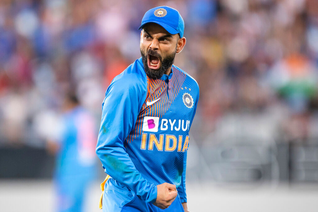 Captain Virat Kohli reacts to taking the catch to dismiss Martin Guptill from New Zealand during their Twenty/20 cricket international in Auckland on Sunday