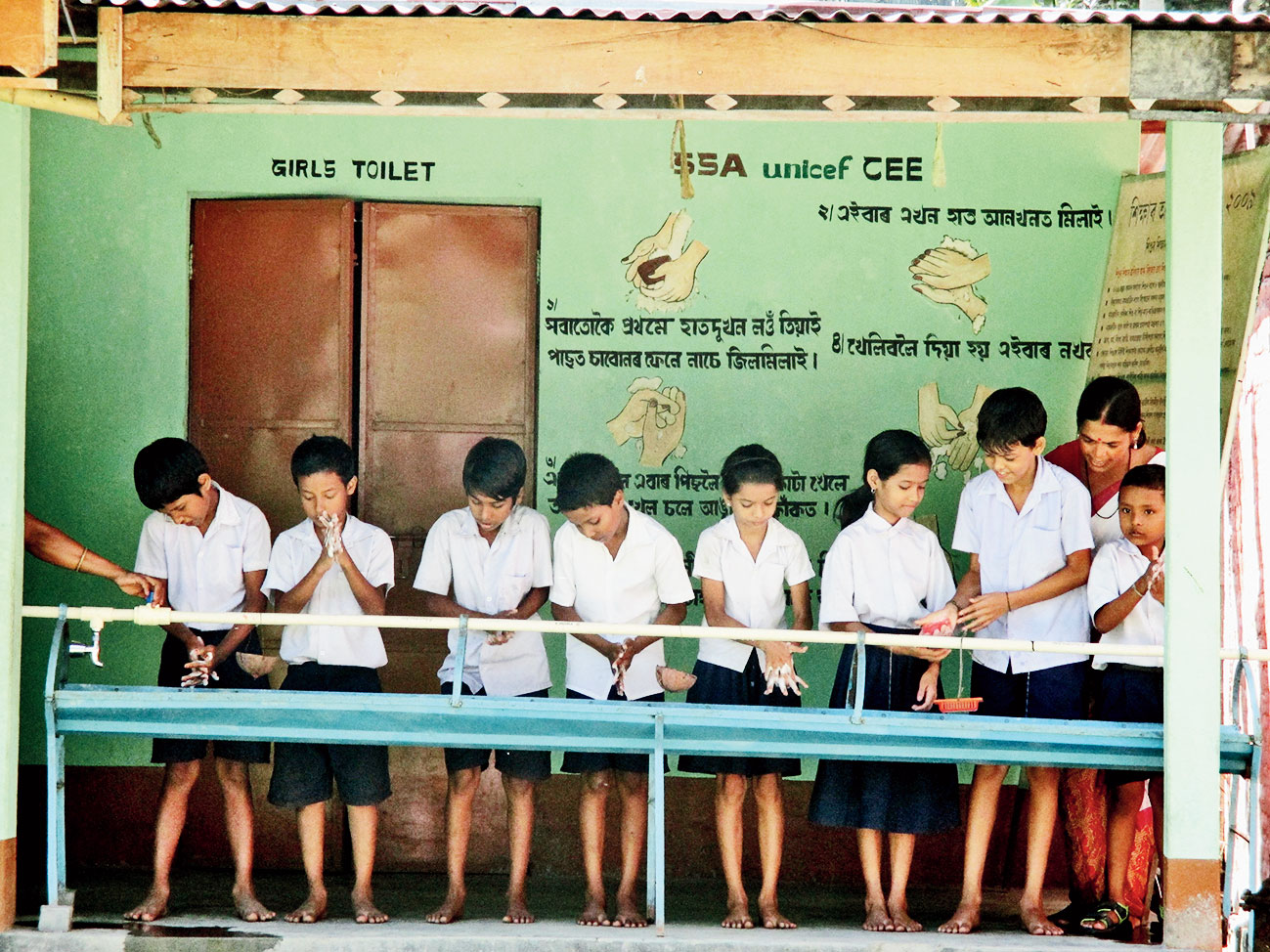 Students of Baruajani Bapuji LP School in Kamalpur block wash their hands as part of the camapaign. 
