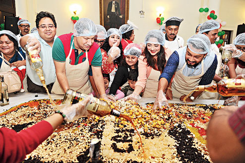 Cake mixing ceremony held at Mascot Hotel | Events Movie News - Times of  India