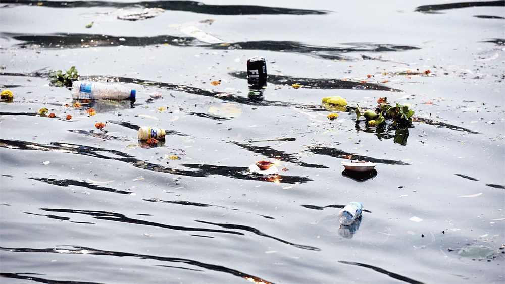 Plastic bottles, flowers and other items float in Calcutta's Rabindra Sarobar lake after the Chhath rituals on Wednesday, November 14. Authorities allowed devotees to use it for rituals in violation the National Green Tribunal's orders
