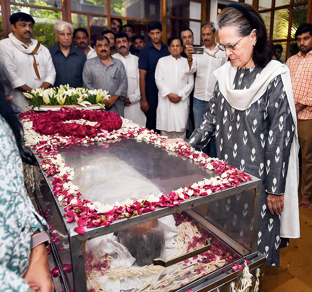 Sonia holds the coffin as she pays her last respects on Saturday. Sonia wrote to Dikshit’s children: “I write to you with my heart filled with grief and a great sense of loss, for your beloved mother occupied a huge space in it.”