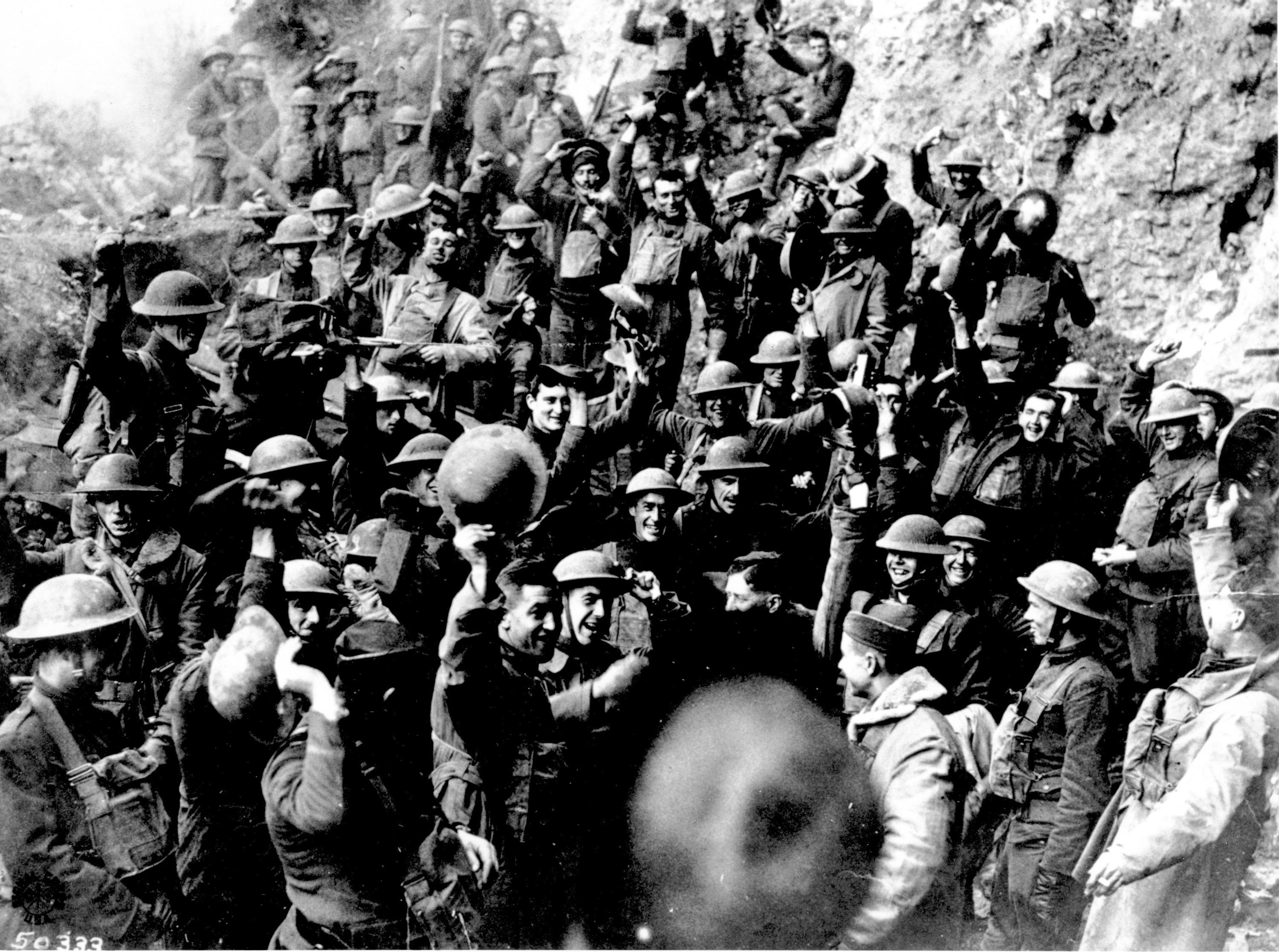 American troops cheer after hearing the news that the Armistice had been signed, ending World War I on November 11, 1918.