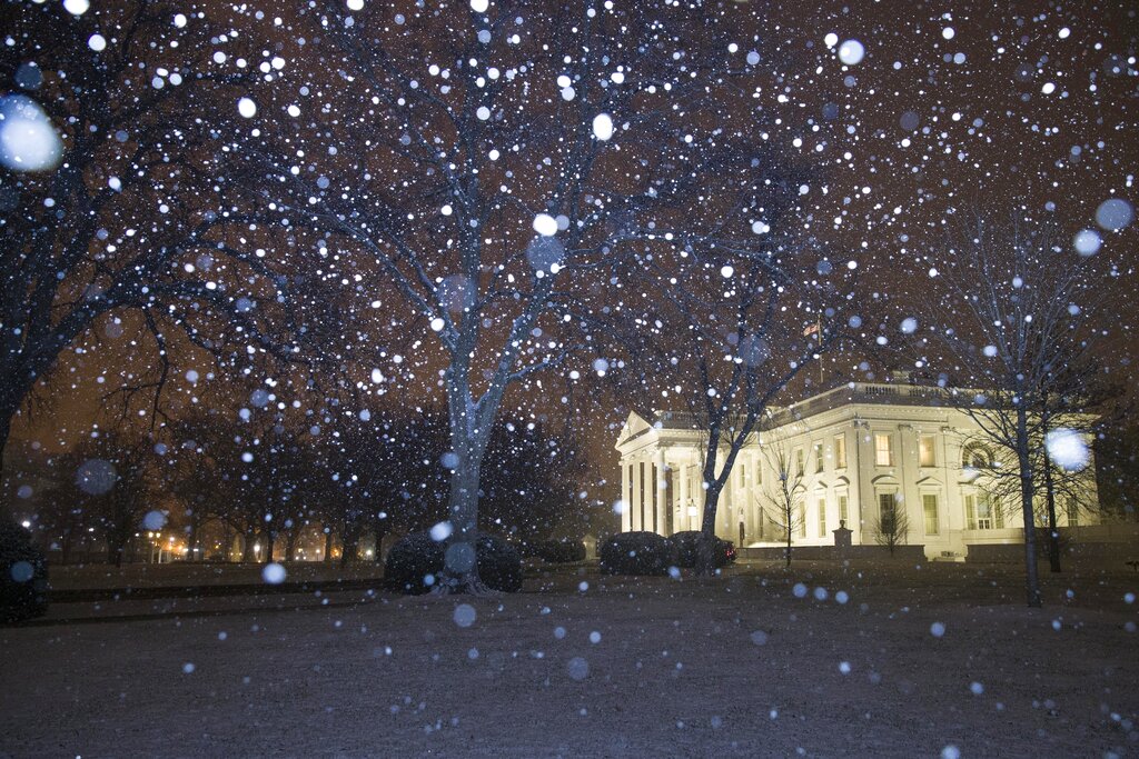 Snow falls on the White House, as Donald Trump's demand for a border wall continues to put a freeze on the government.