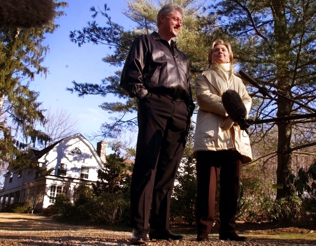  In this January 6, 2000, file photo, Bill and Hillary Clinton stand in the driveway of their new home in Chappaqua, where an explosive device was found on Tuesday. 