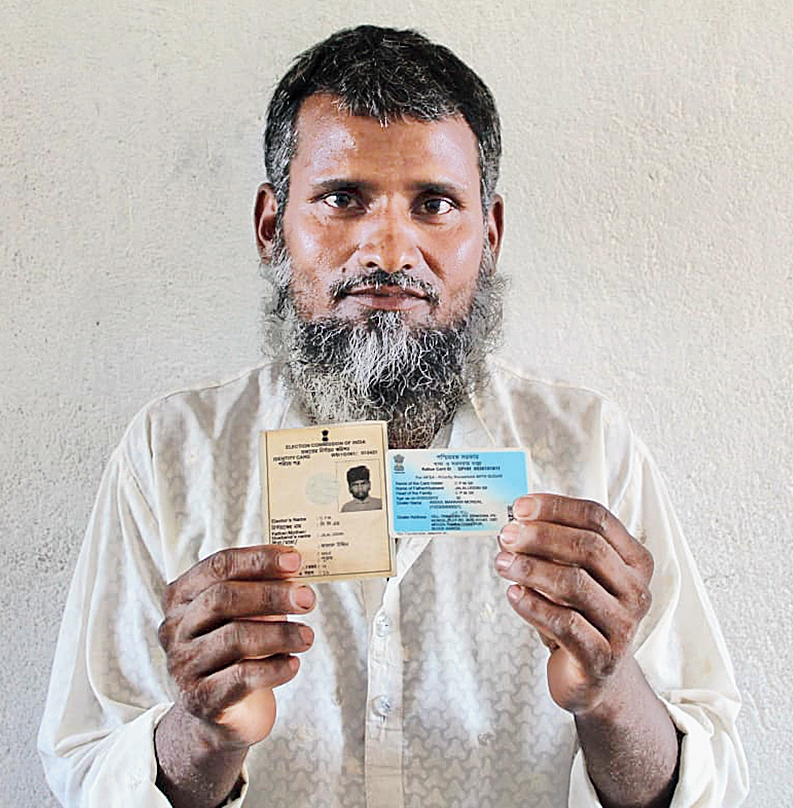 Jalaluddin with his son’s voter card and ration card mentoning his name as CPM