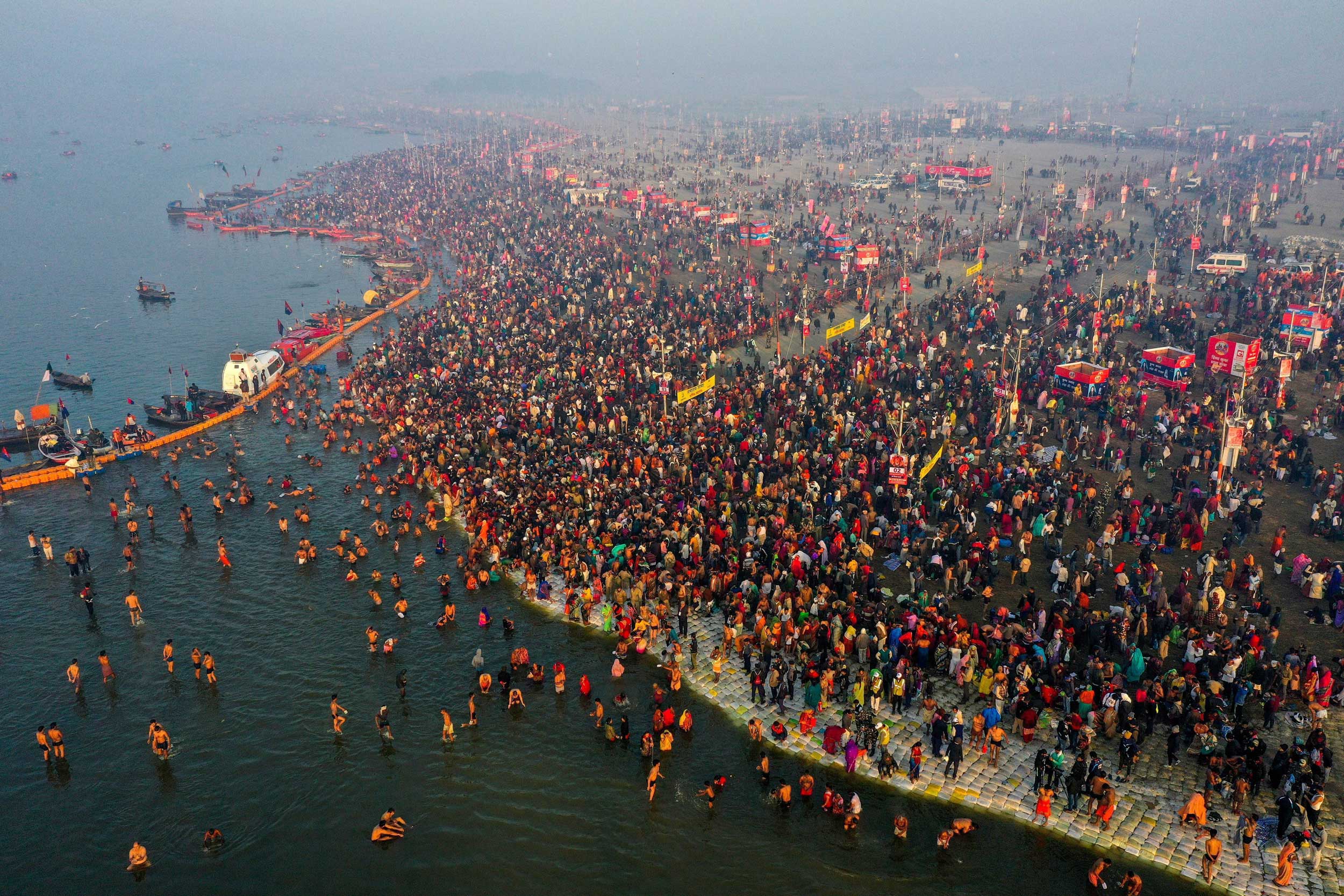 Devotees gathered at Sangam to take a holy dip on the occasion of 'Paush Purnima' during the Kumbh Mela on Monday