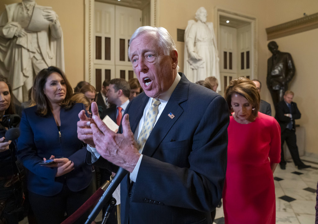 House majority leader Steny Hoyer (centre) and Speaker Nancy Pelosi push back on President Donald Trump's demand for funding to build a wall on the US-Mexico border as the partial government shutdown is in its second week, at the Capitol in Washington on Thursday.
