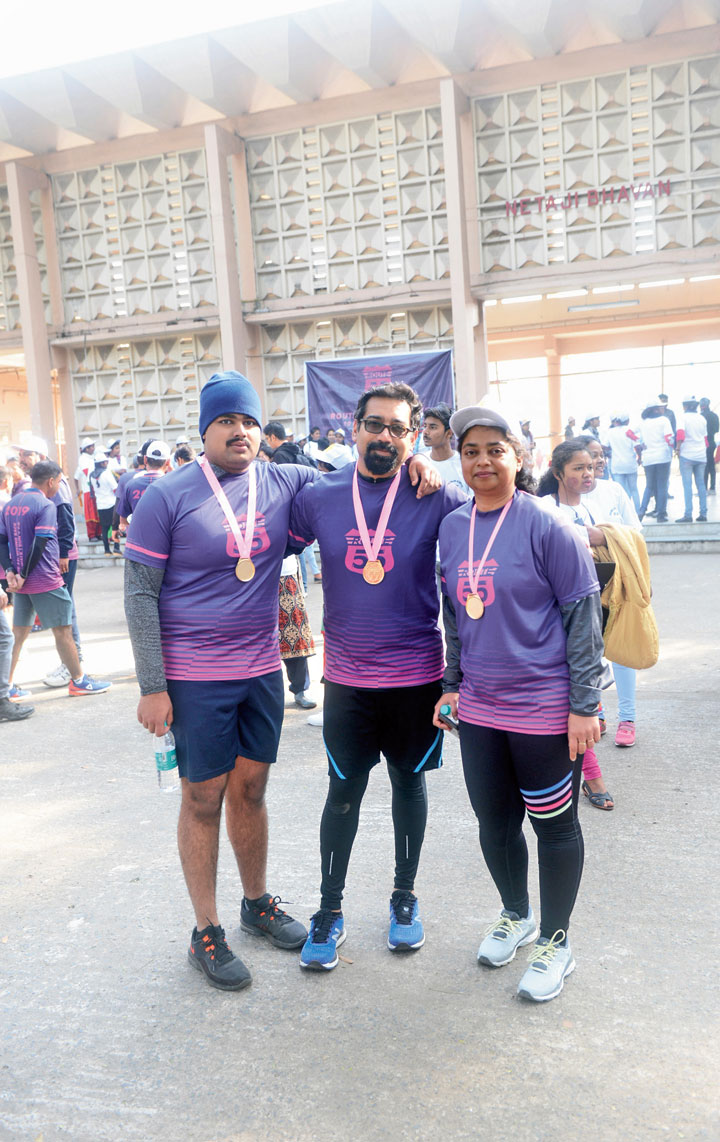 Prantik Sinha (centre), wife Moumita Mukherjee and their son at the fund-raising run organised by the alumni of the Indian Institute of Engineering Science and Technology on Sunday. 