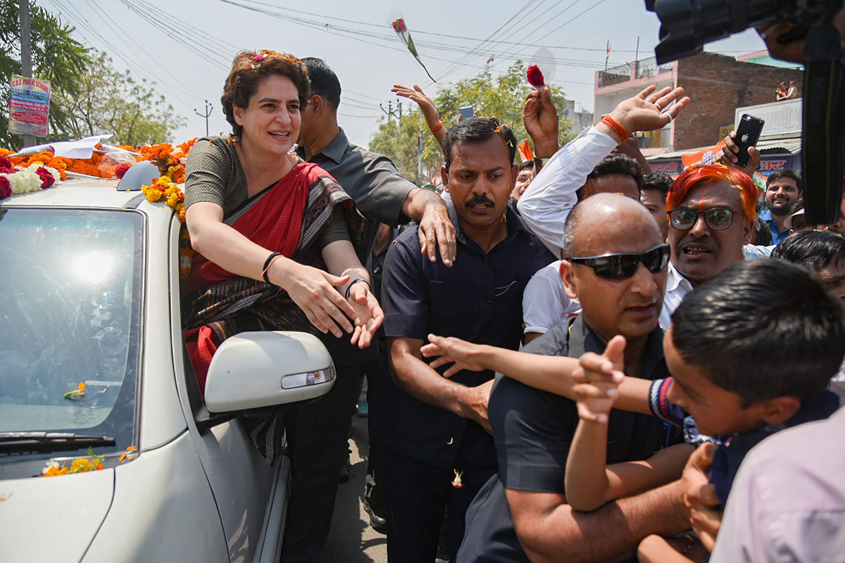 Congress General Secretary UP-East Priyanka Gandhi Vadra waves to her party supporters during a roadshow, ahead of Lok Sabha elections, at Kumarganj, in Faizabad, Friday, March 29, 2019. 