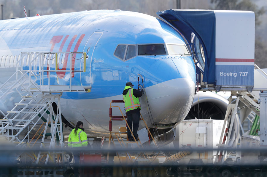 A worker stands on a platform near a Boeing 737 MAX 8 airplane being built for TUI Group at Boeing Co.'s Renton Assembly Plant on Wednesday. 