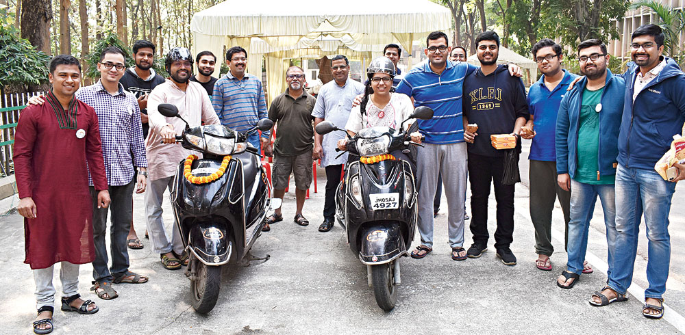 Smart ride: Bhavin Shah (in maroon) with his scooters for hire on XLRI campus in Jamshedpur.