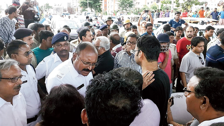 Police pacify residents during the road blockade on November 1.