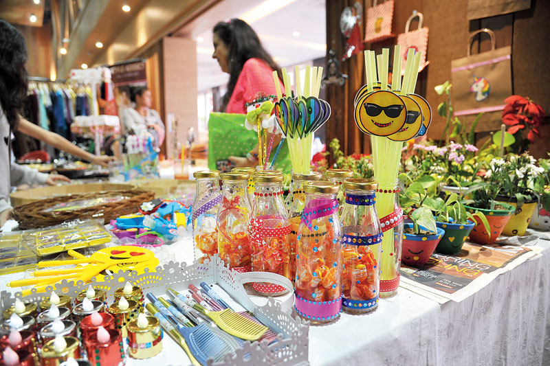 This stall sold stationery items and decorated glass bottles. Other items on sale were candles, combs and potted plants.