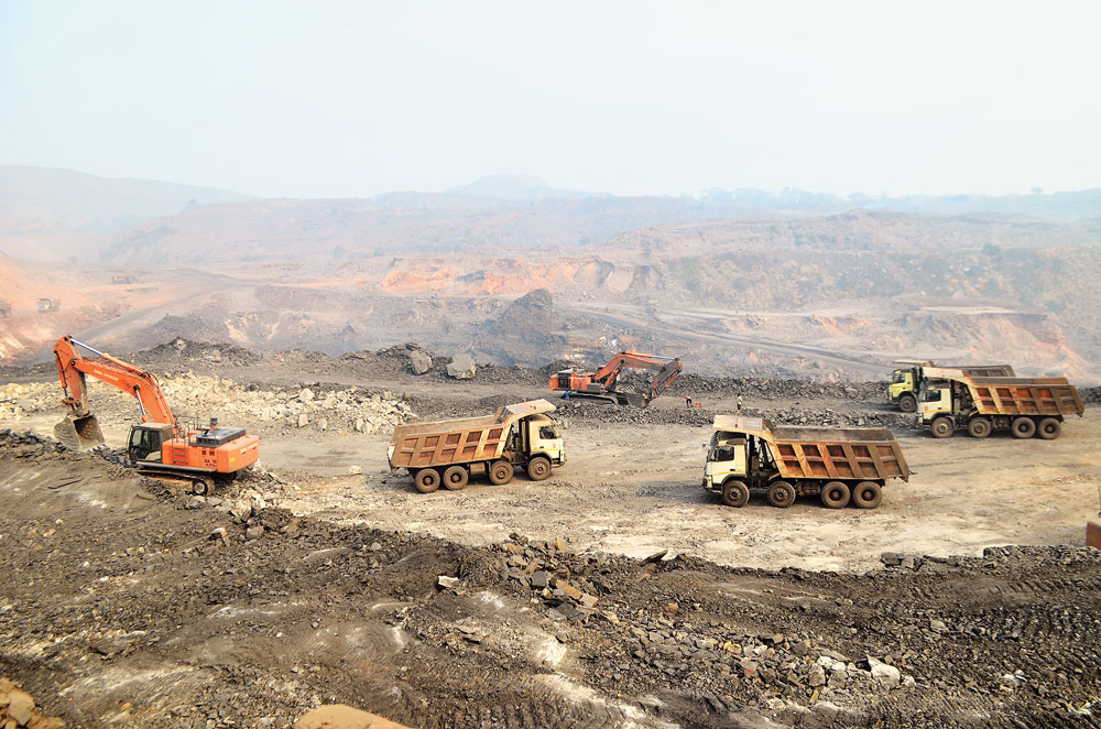 Defiant fleet: Tipper trucks ferry coal from a BCCL mine in Kusunda, Dhanbad, during the nationwide trade union strike on Tuesday. 
