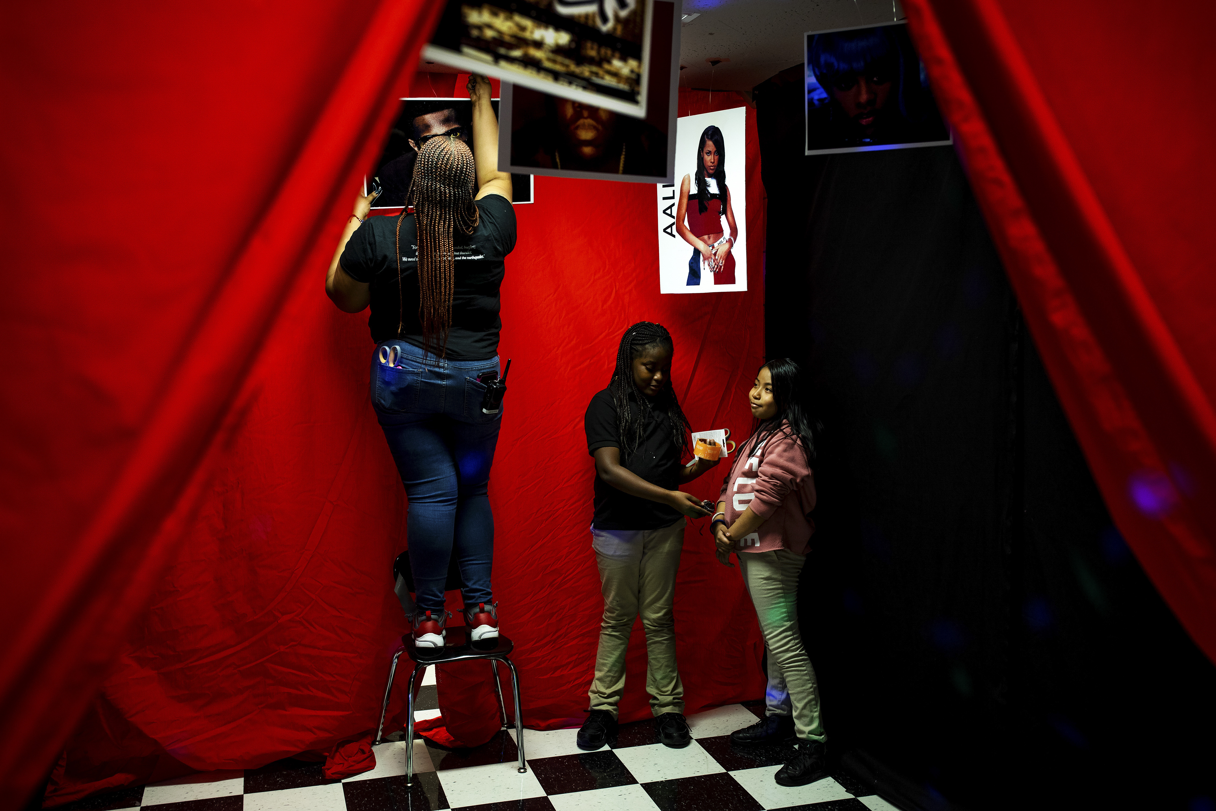 Students at Ember Charter School decorate the hallways with photographs of black and Hispanic artists from Brooklyn.