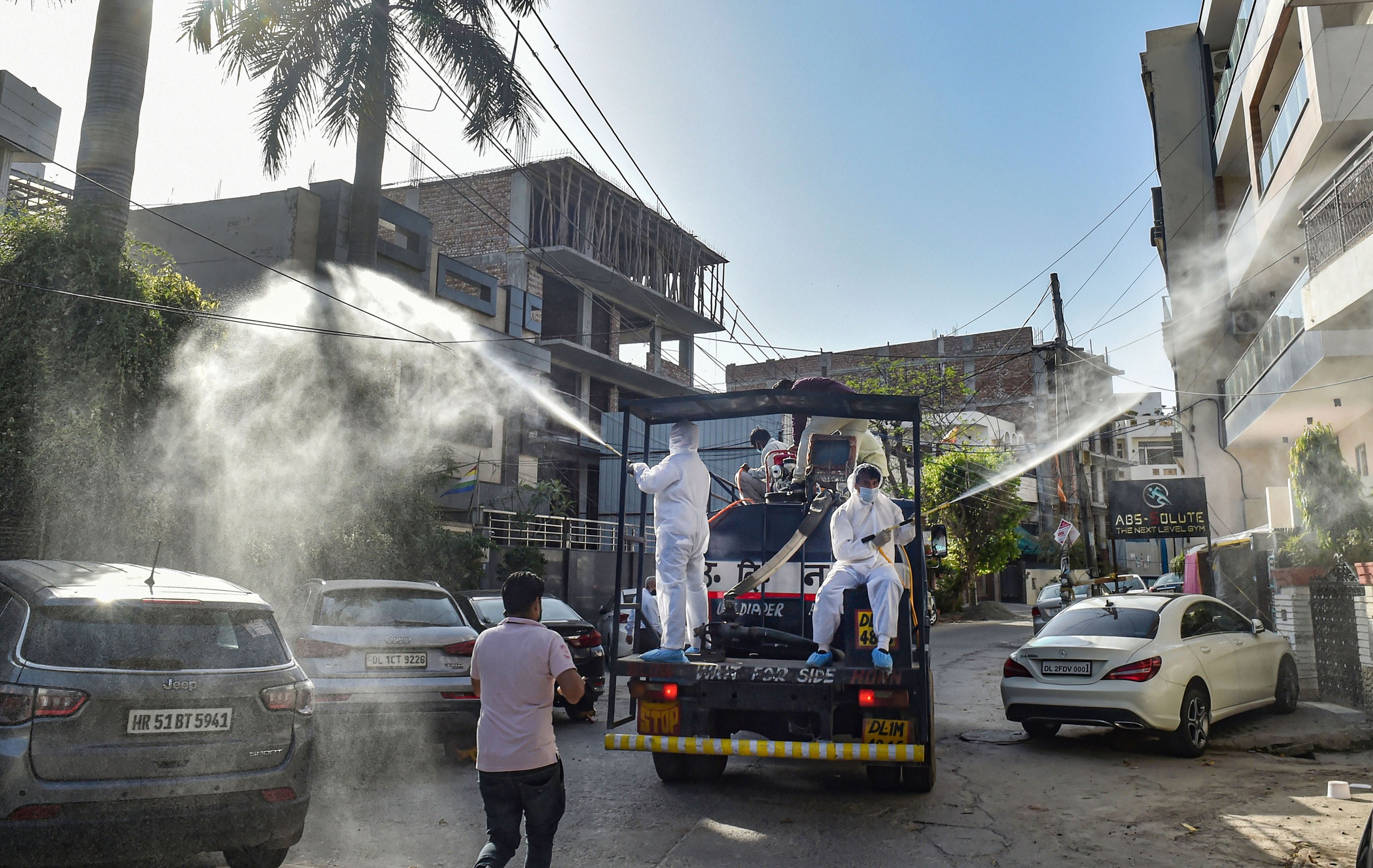 North MCD workers sanitise a locality in Model Town area to contain the spread of coronavirus, during the ongoing nationwide lockdown, in New Delhi, Monday, April 6, 2020