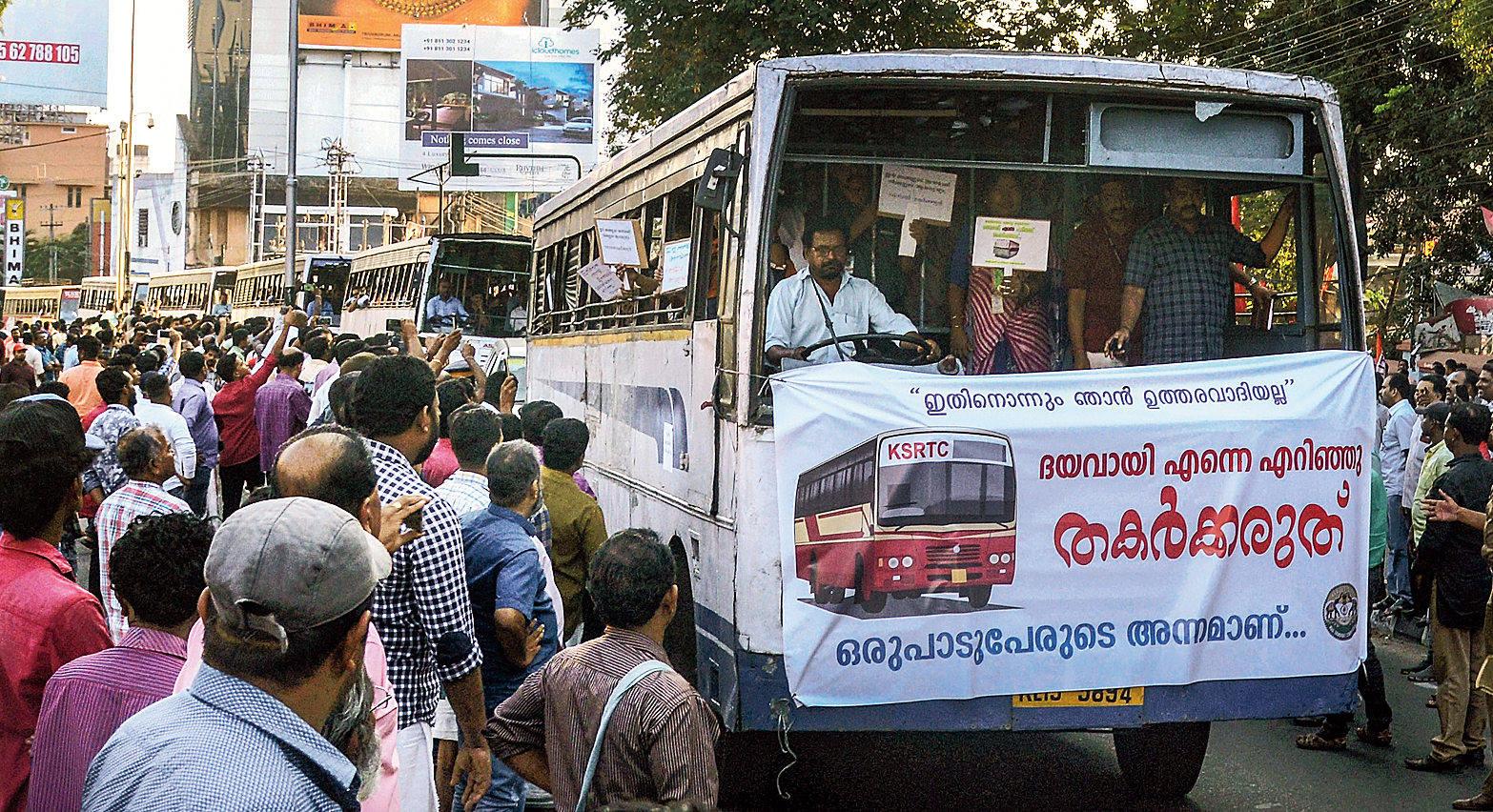 “I am not responsible for any of this. Please don’t smash me up with stones. A lot of people depend on me for their bread,” cries the banner wrapped around a state-run bus in Thiruvananthapuram on Thursday after several such buses were damaged during the shutdown.