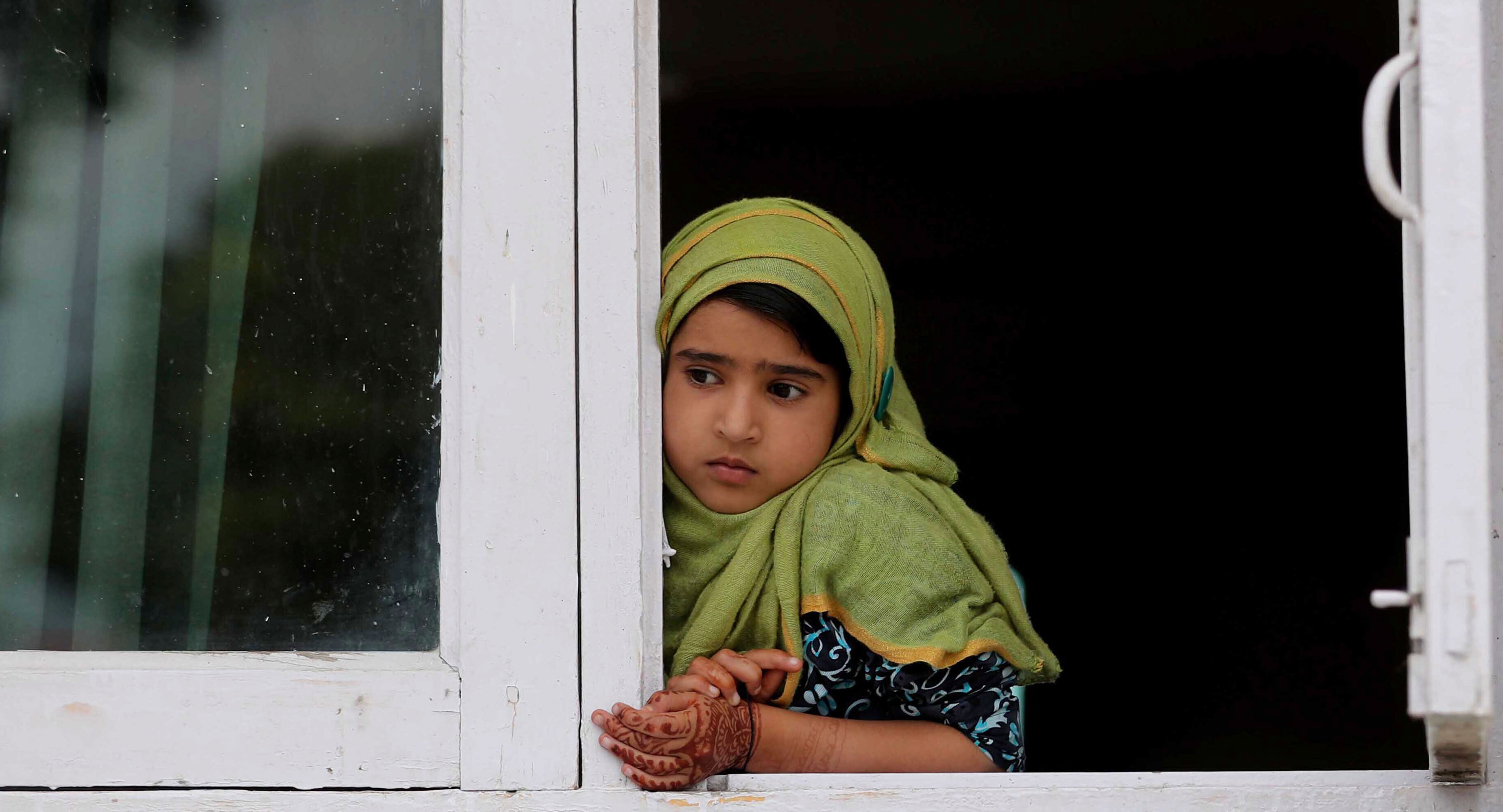 A Kashmiri child watches a protest in Srinagar on August 30, 2019. The sexual fantasies that have been unleashed around Kashmir — the top Google searches in India immediately after August 5 were ‘marry Kashmir girl’ and ‘Kashmiri girls’ — are not innocent. They are misogynistic. 