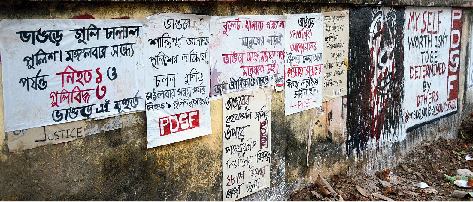 Posters in a portion of a wall.