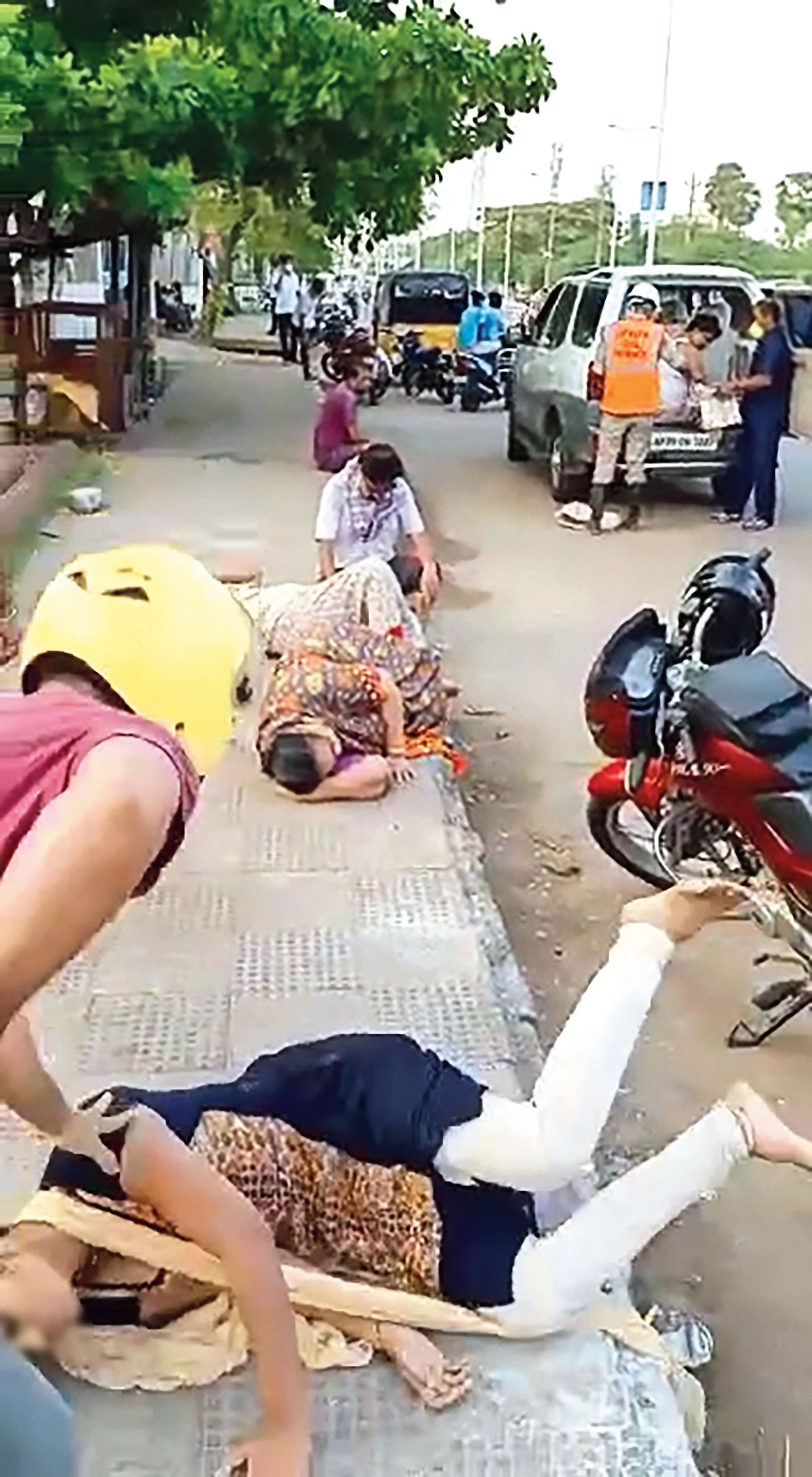 Footage shows a woman falling when she tried to sit after the gas leak at Venkatapuram village, where the LG Polymers plant is located, in Visakhapatnam on Thursday.