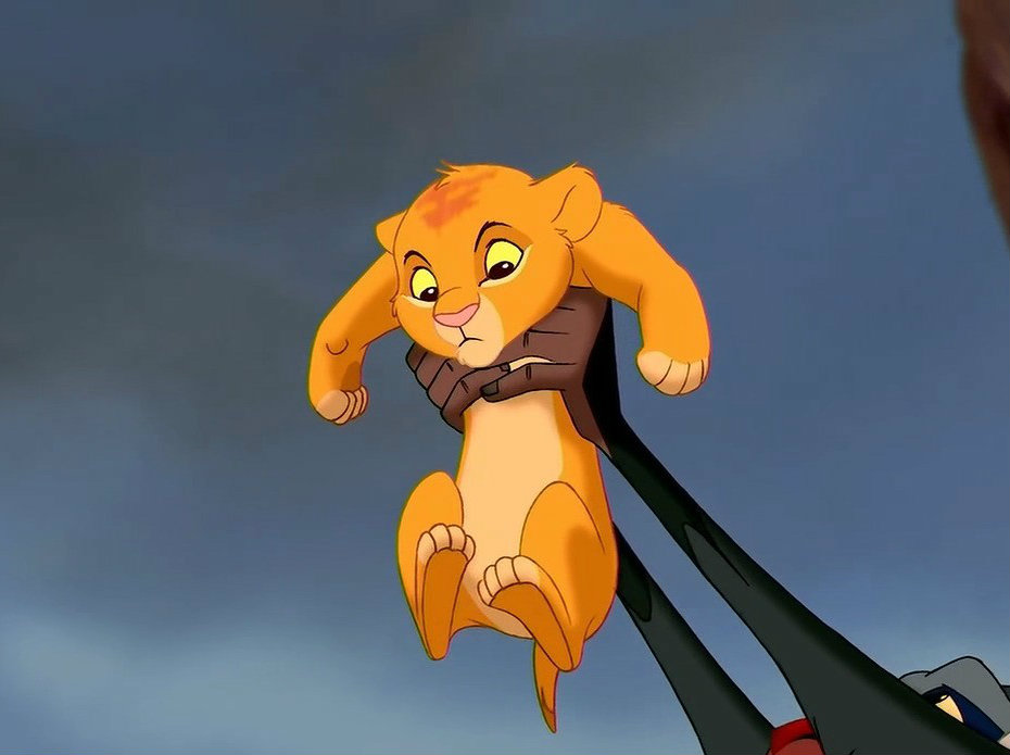 Simba being held aloft in a scene from The Lion King.