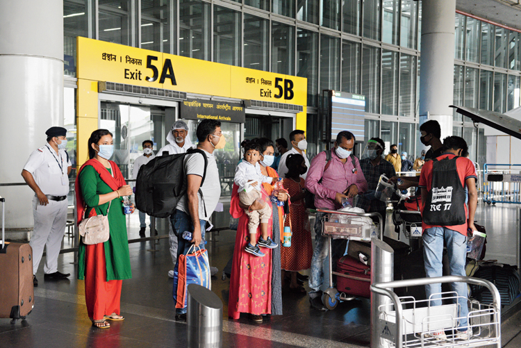 Passengers from Dhaka at the airport on Wednesday. 