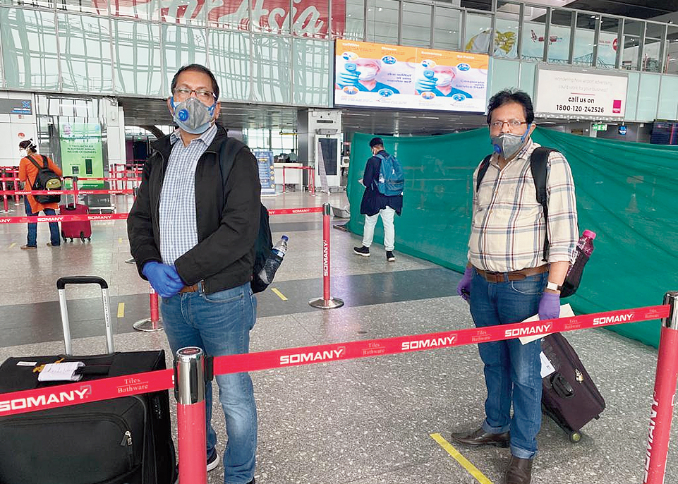 Social distancing in front of check-in counter. Yellow lines have been drawn and passengers have to stand behind each line. If the queue extends till the last yellow line, the airline will open another counter where the same distancing norms will be followed