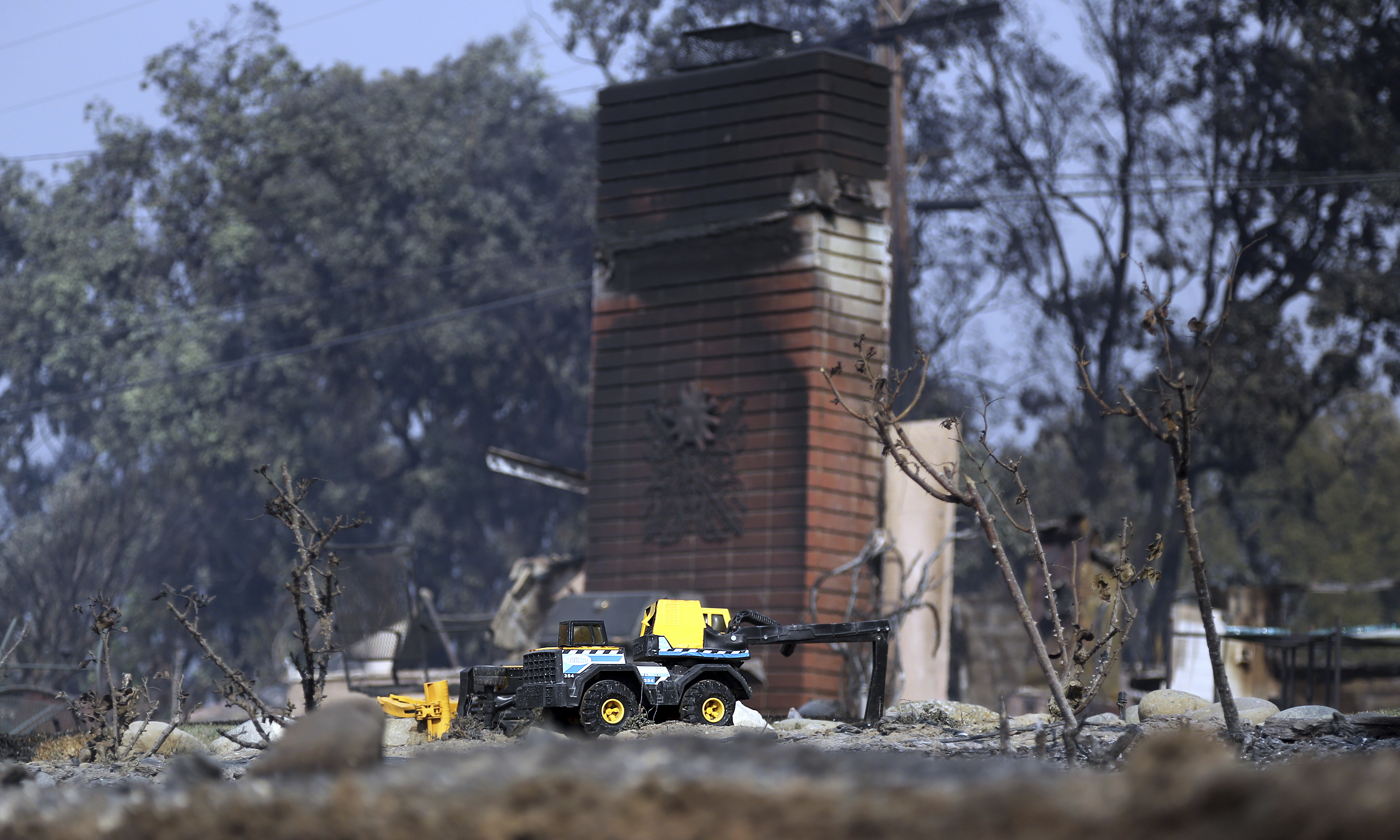 A child's toy stands in the ruins of one of at least 20 homes destroyed in the Point Dume area of Malibu.
