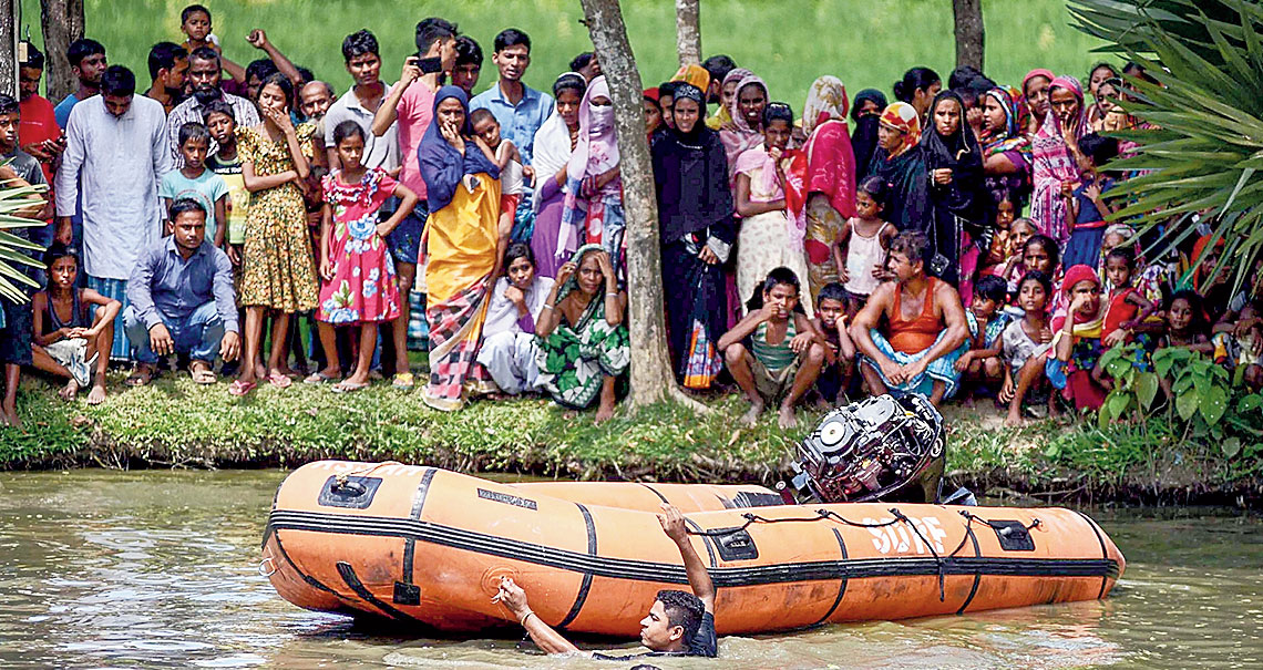 SDRF personnel during the rescue operation and in Nagaon district on Friday. 
