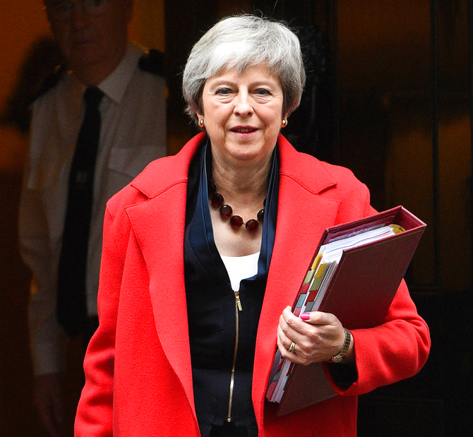 British Prime Minister Theresa May leaves 10 Downing Street, London, for the House of Commons to face Prime Minister's Questions, on Wednesday.