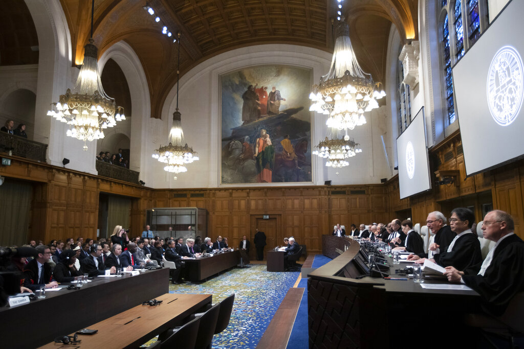 Judges take their seats prior to reading a ruling at the International Court in The Hague, Netherlands, Thursday, January 23, 2020.