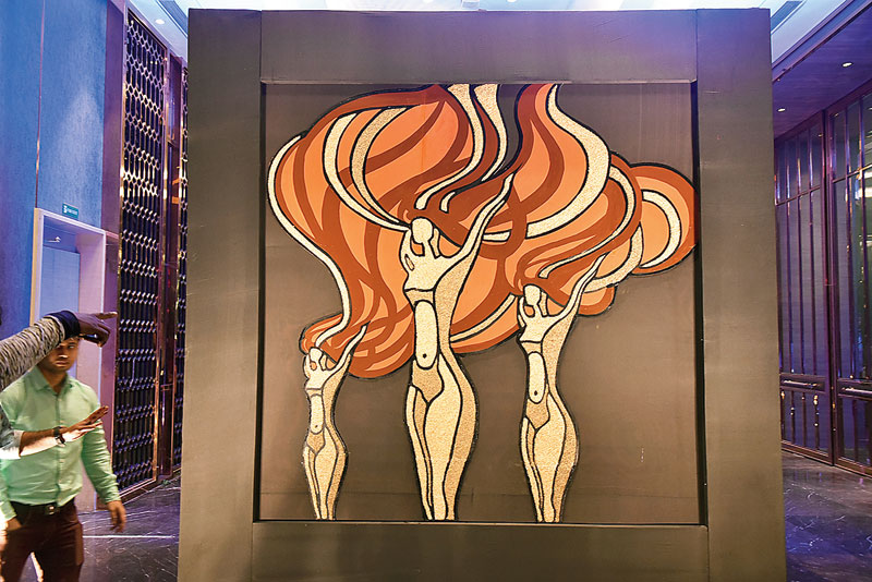 chawal work: Vibrant and intricate! This 12-feet-tall installation was made with rice. “This piece took about a week to put together. We had to convert the trophy, designed by Narayan Sinha, into an illustration and then get to the rice, painting and artwork. The trophy somehow resembles a woman in a forest so we tried to bring that out in this piece,” said Swarup. “There is a lot of intricacy involved when it comes to tracing the trophy and putting it in a frame. We used at least 50kg of rice for this art piece,” said Baisakhi.