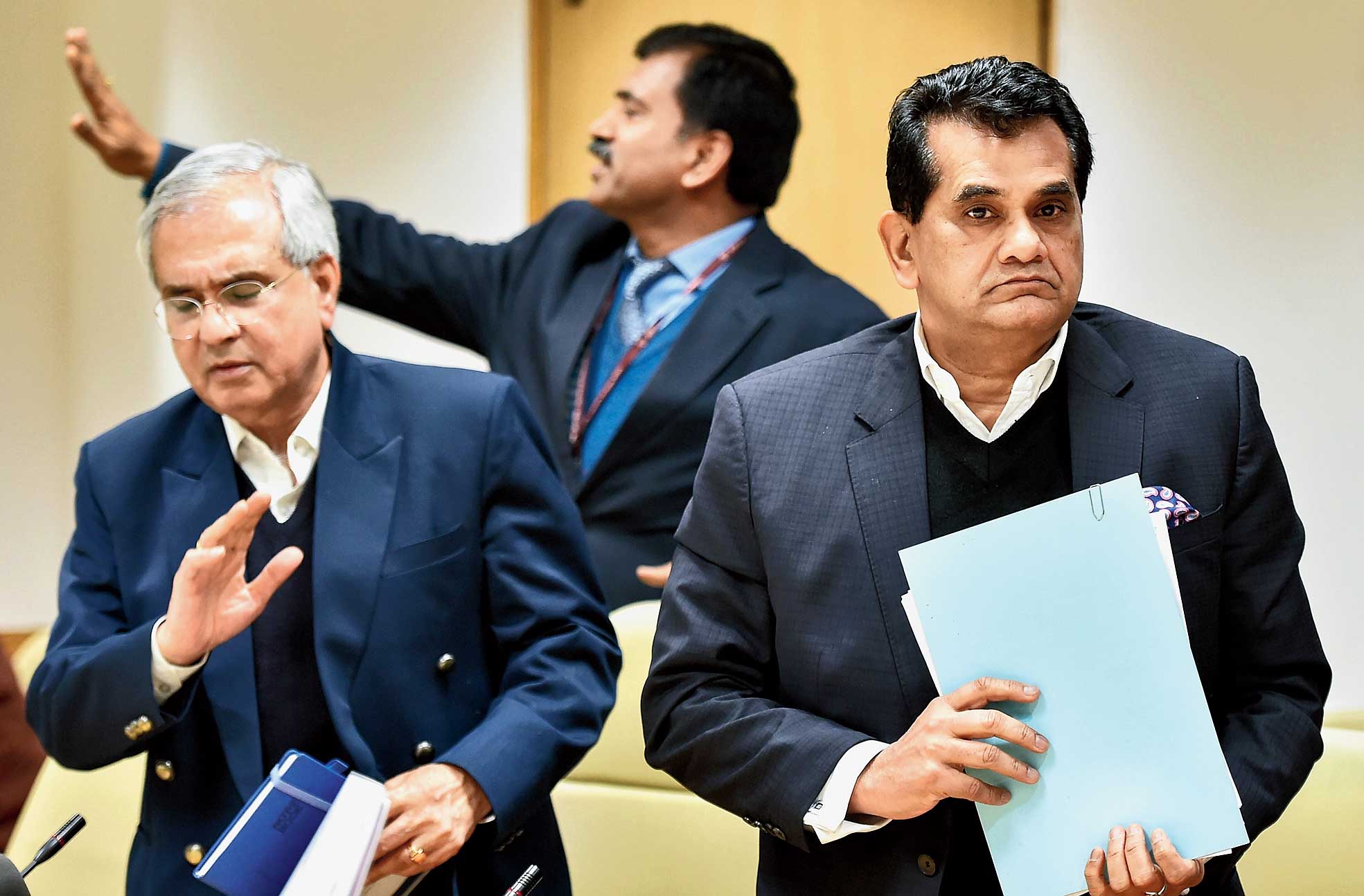 Niti Aayog vice-chairperson Rajiv Kumar (left) and CEO Amitabh Kant leave after addressing the news conference in New Delhi on Thursday. 