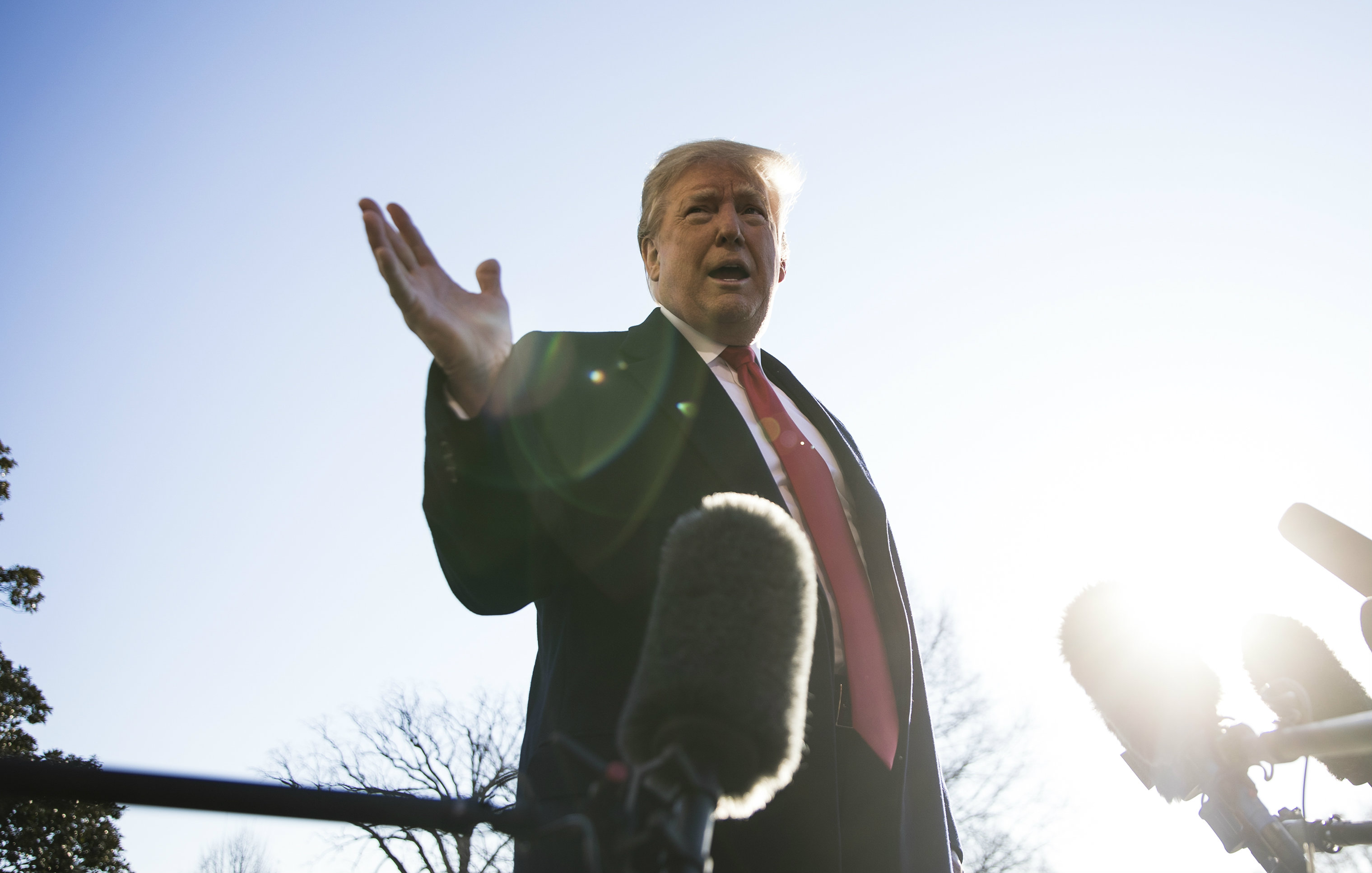 Donald Trump speaks to reporters on Sunday as he departs from the White House for Camp David, where he will meet with senior staff to discuss the shutdown and border security. 