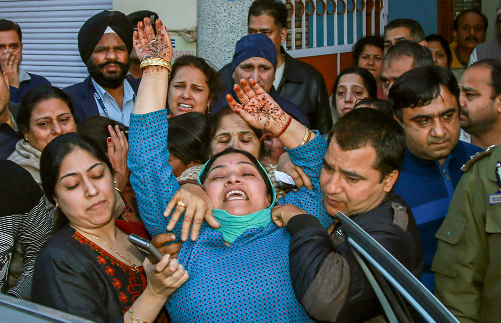 Bereaved family members of slain Deputy Superintendent of Police Operations Aman Thakur, who was killed in an encounter at Turigam area of South Kashmir’s Kulgam district, mourn at their residence in Resham Ghar, Jammu on Sunday, Feb. 24, 2019. 