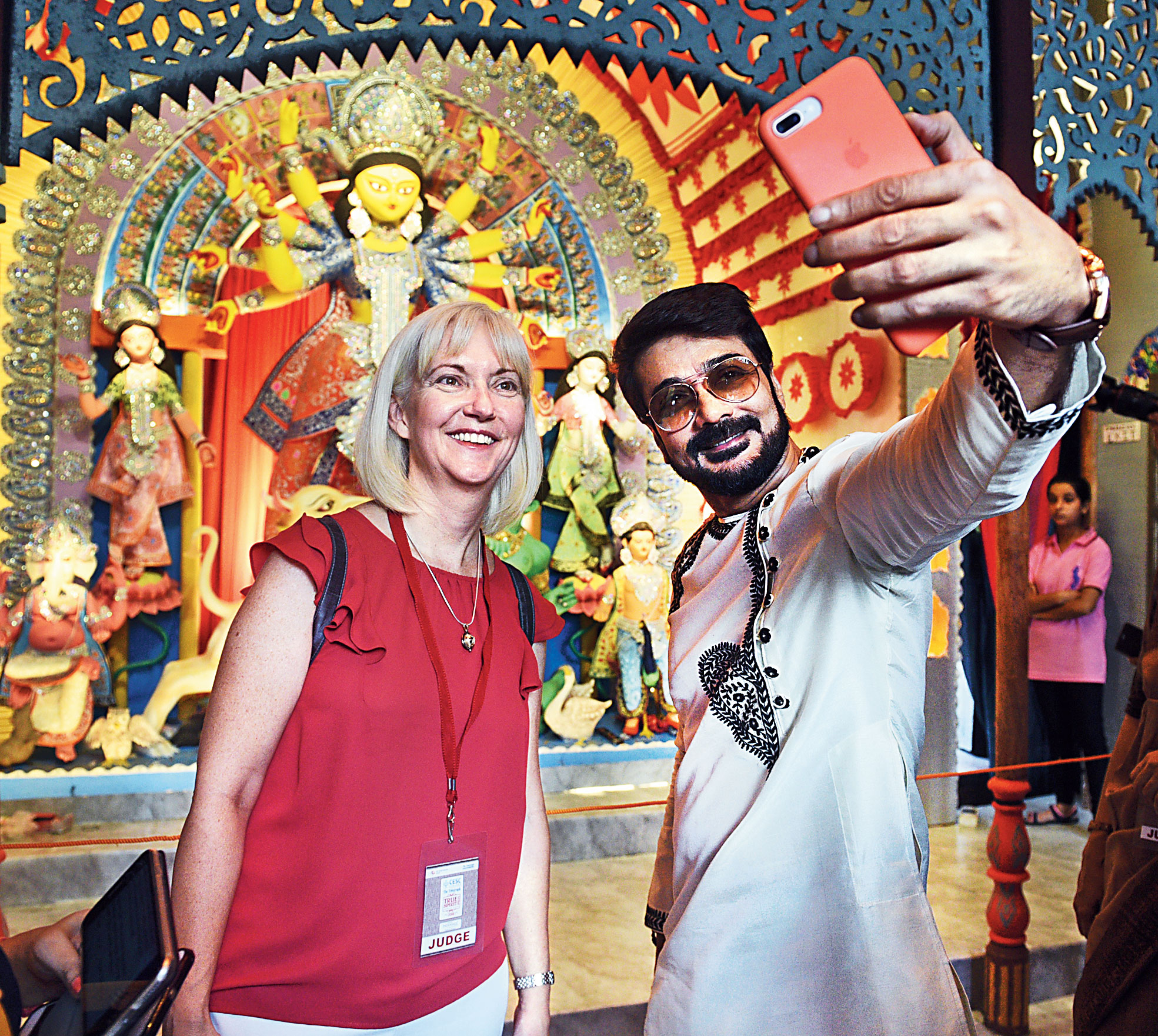Prosenjit and Patti Hoffman take a quick selfie in front of the idol before resuming judging duties