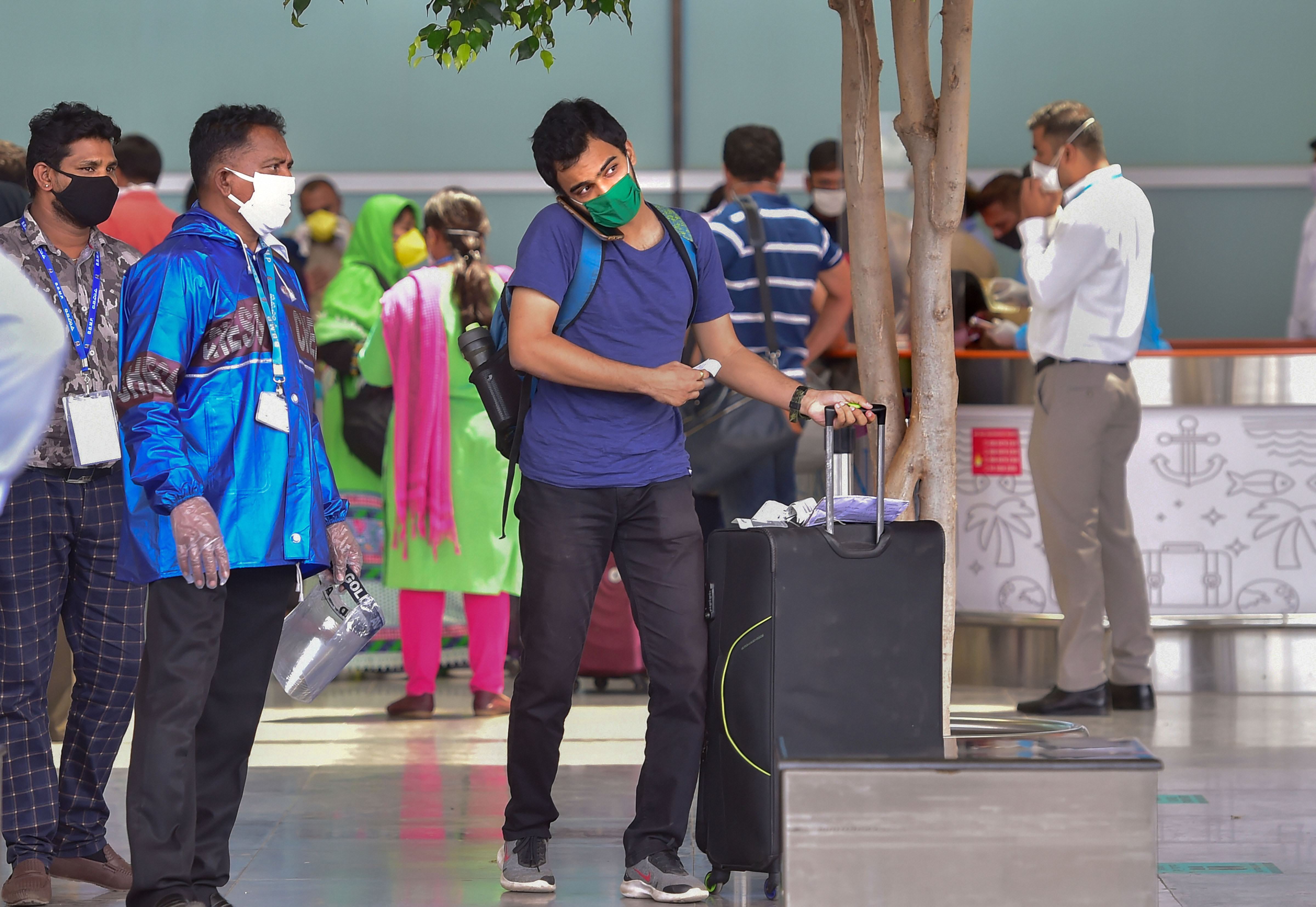 Passengers leave for a quarantine centre as they check-out from the Kempegowda International Airport, in Bengaluru, Monday, May 25, 2020. 