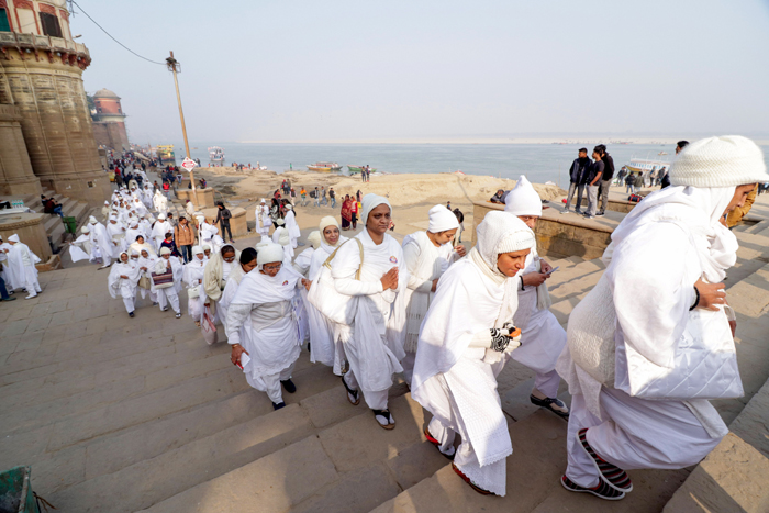 Jain devotees visit Assi Ghat during their Atma Shanti Yatra, in Varanasi, on Tuesday