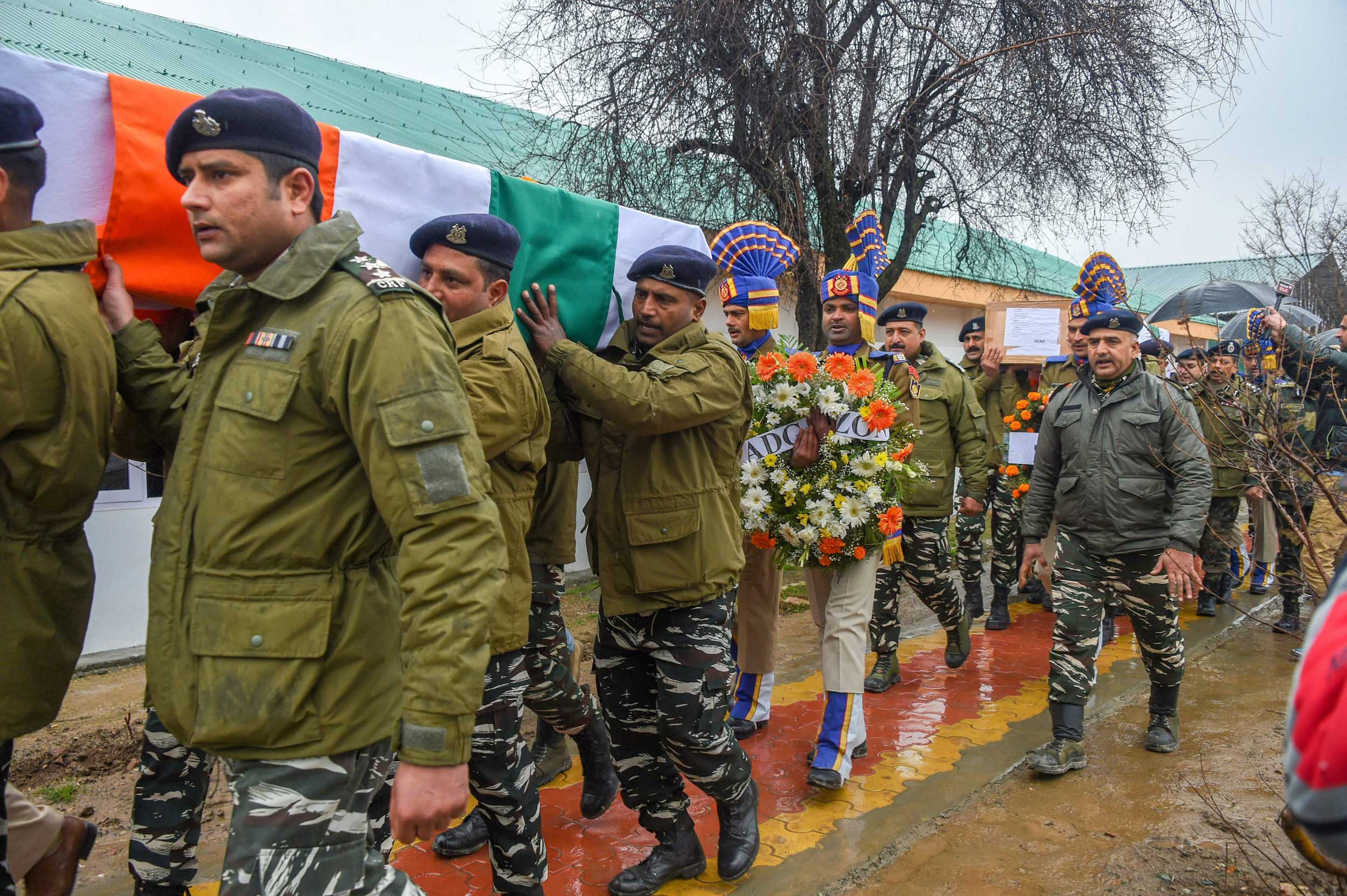 CRPF personnel carry the remains of inspector Pinto Kumar Singh and Ct. Vinod Kumar on Saturday.