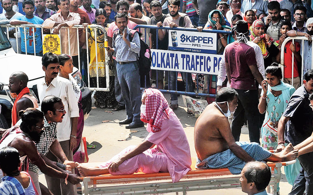 Patients being evacuated from Calcutta Medical College and Hospital after a fire broke out