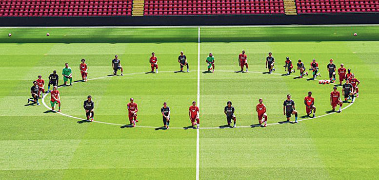 Liverpool players take a knee around the centre circle at Anfield on Monday in a gesture of support for George Floyd. “Unity is strength #BlackLivesMatter”, the players tweeted.
