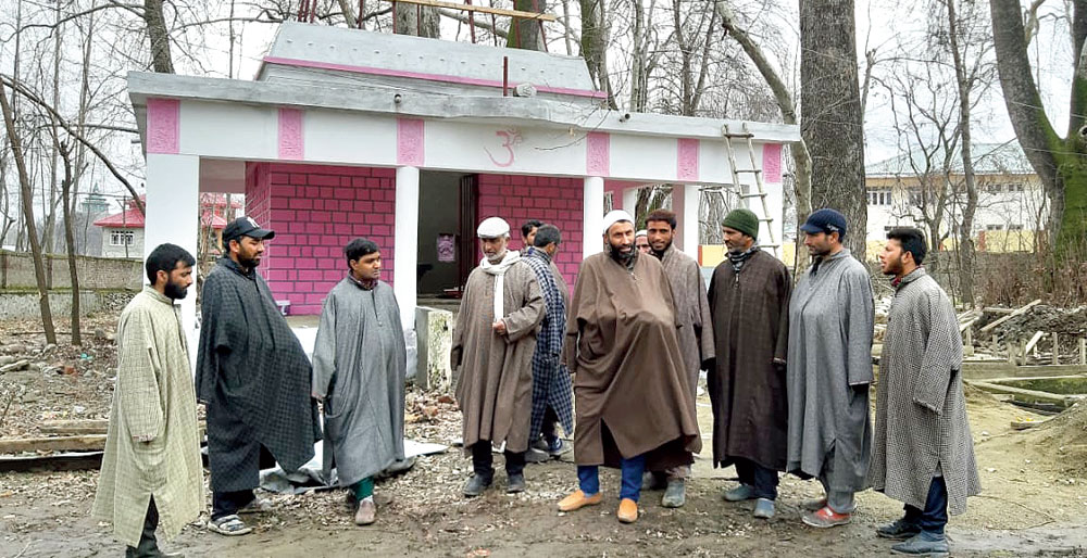 Villagers outside the temple in Pulwama.