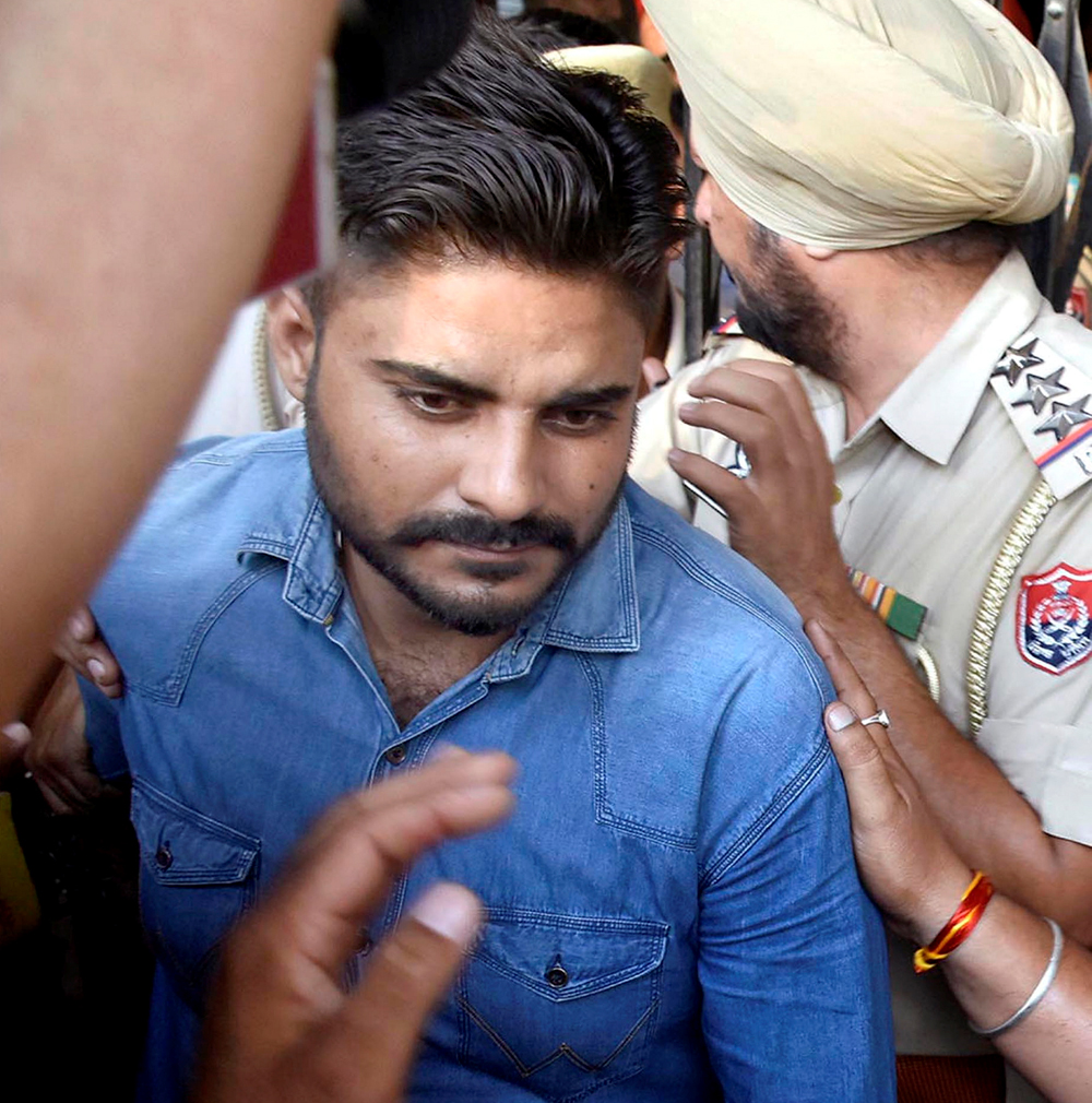 Deepak Khajuria being taken to the District and Sessions Court in Pathankot, Punjab.